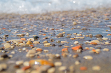 Sea beach on a sandy beach and stones