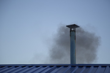 the smoke from the chimney