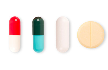 Medicine pill capsules isolated on white background. top view