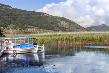 Fototapeta na wymiar Mugla, Turkey, 24 May 2012: Boats at Azmak Stream, Gokova Bay, Akyaka