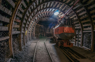 Fototapeta na wymiar Tunnel in the mine, track, coal car
