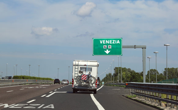 motorhome traveling on the highway towards Venice in the summer