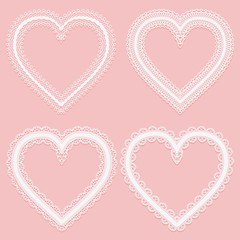 Set of frames of white wide lace ribbons in the shape of a heart.