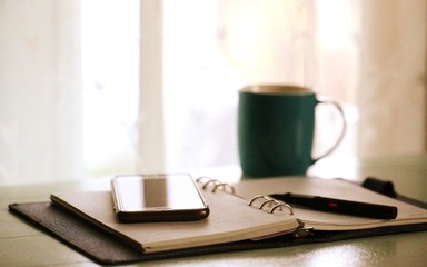 Interior home work desk closeup window blur background with vintage colors tones