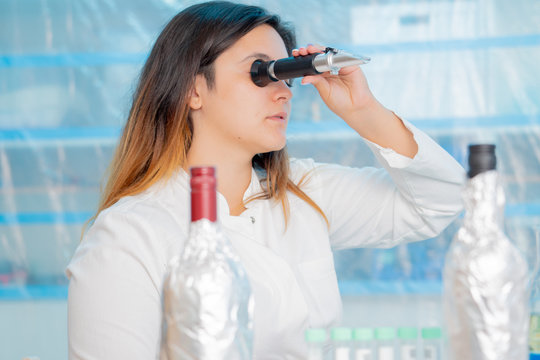  juice and wine  in inspection, lab, measurement of sugar content with Refractometer