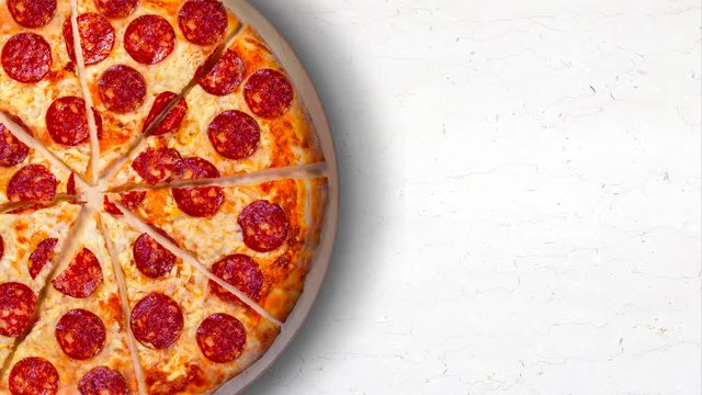 Video pepperoni pizza on a white marble kitchen table. 