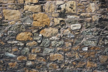 Colorful ancient stone wall horizontal background