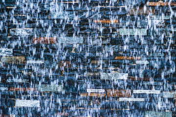 beautifull background  - waterfall in font of stonewall