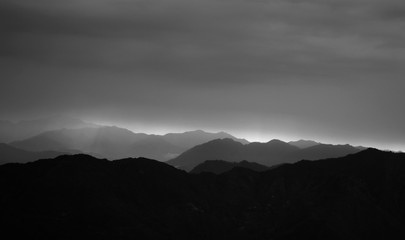 dark mountain landscape with heavy clouds black and white