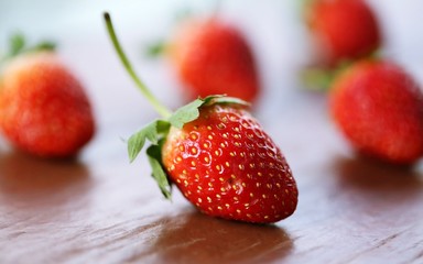 Fresh red strawberry closeup macro blur background