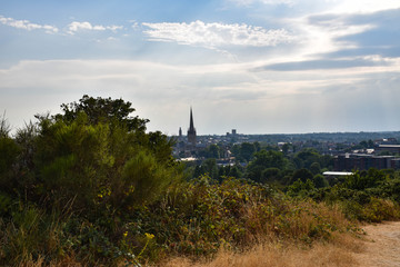 Fototapeta premium Panoramic daytime view over Norwich City and Cathedral from St James Hill, Mousehold Heath, Norwich