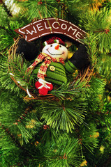 Snowman Wreath hanging on Christmas Tree with welcome message