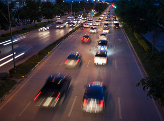 Fototapeta na wymiar Car traffic at night. Motion blurred blur