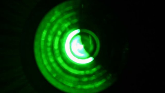 Close-up of soft focused spinning green LED lights