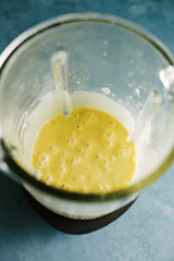 Fresh turmeric smoothie in blender