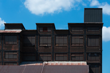 Old Industrial building against blue sky