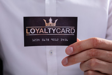 Businessman Holding Loyalty Card