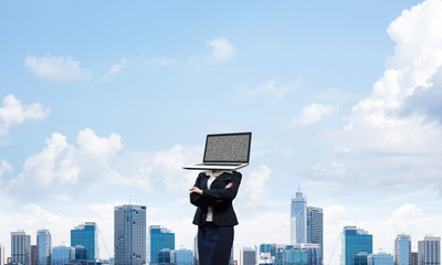 Business woman with laptop instead of head.