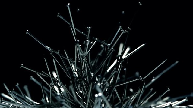 Metal nails under the influence of a magnetic field. Abstract background.
