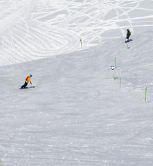 Two snowboarders downhill