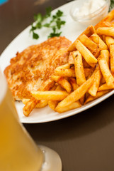 Vienna schnitzel and French fries. Traditional Austrian dish.