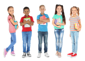 Cute school children with stationery on white background