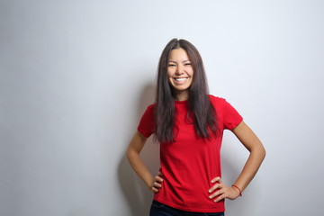 Attractive young woman posing on light background