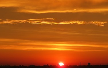 Beautiful orange golden sunset background over the city 