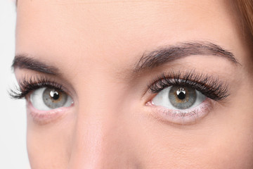 Obraz premium Beautiful young woman with eyelash extensions, closeup