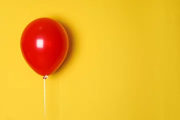 Foto op Canvas Red balloon on color background. Celebration time © New Africa