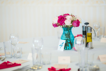 Wedding table set up. Indoor set up of a wedding/party table with fresh flowers.