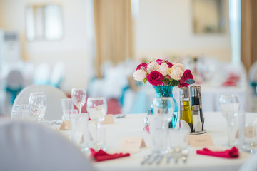 Wedding table set up. Indoor set up of a wedding/party table with fresh flowers.