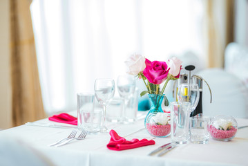 Wedding table set up. Indoor set up of a wedding/party table with fresh flowers.