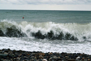Breaking powerful waves at rising storm 