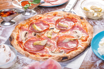 Close up of delicious ham and anchovies pizza