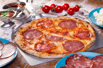 appetizing italian salami pizza with ingredients