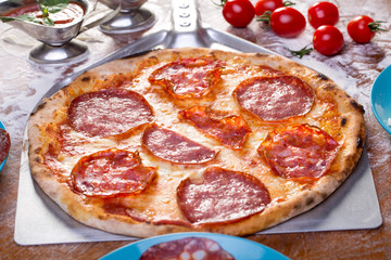 appetizing italian salami pizza with ingredients