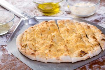 Details of pizza focaccia with olive oil, parmesan and garlic