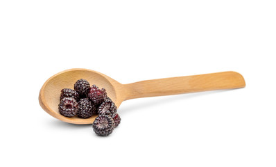 Wooden spoon with black raspberry on white background. Healthy eating.
