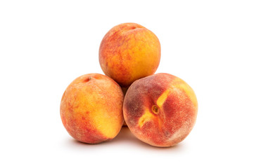 Fototapeta na wymiar Pile of peaches on white.