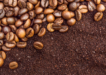 Background of ground coffee and coffee beans. Top view.
