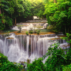 Fototapeta na wymiar Waterfall in deep rain forest jungle (Huay Mae Kamin Waterfall in Kanchanaburi Province, Thailand)