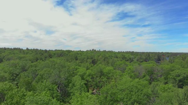 Panning shot to capture the vast scenery of cottage country in Ontario, Canada