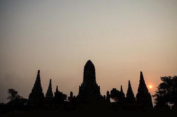 Sunset through pagoda in wat chai watthanaram, Ayutthaya, Thailand