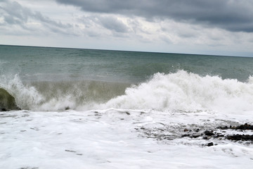 Splash waves of the sea foaming breaking  