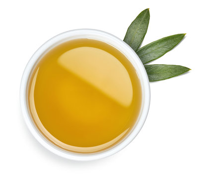 Bowl of olive oil and leaves