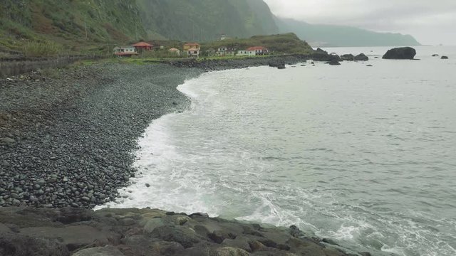 Up view of waves of ocean from cliffy shore of the north of Madeira