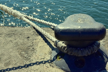 Metal bollard on the quay of the embankment of the Yenisei River in the city of Krasnoyarsk