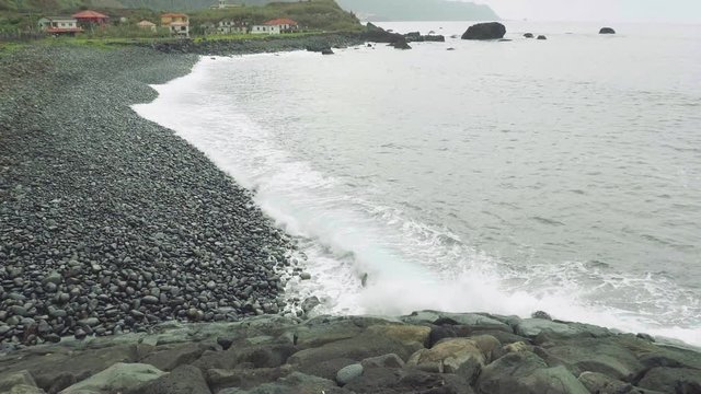 Up view of waves of ocean from cliffy shore of the north of Madeira
