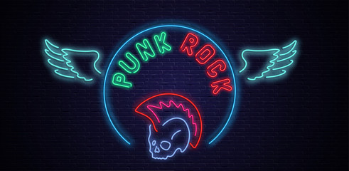 Punk rock neon colorful signboard on black bricklaying wall.